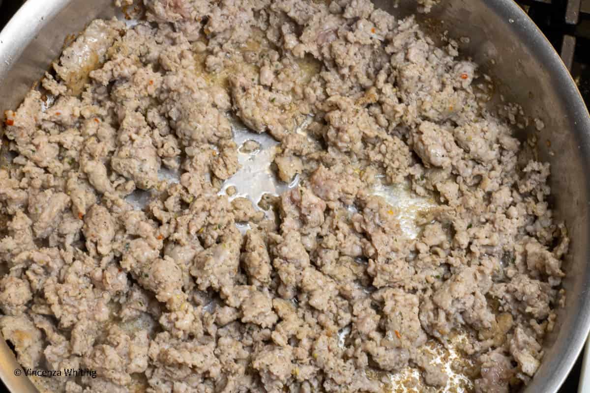 Cooked ground sausage in a pan.