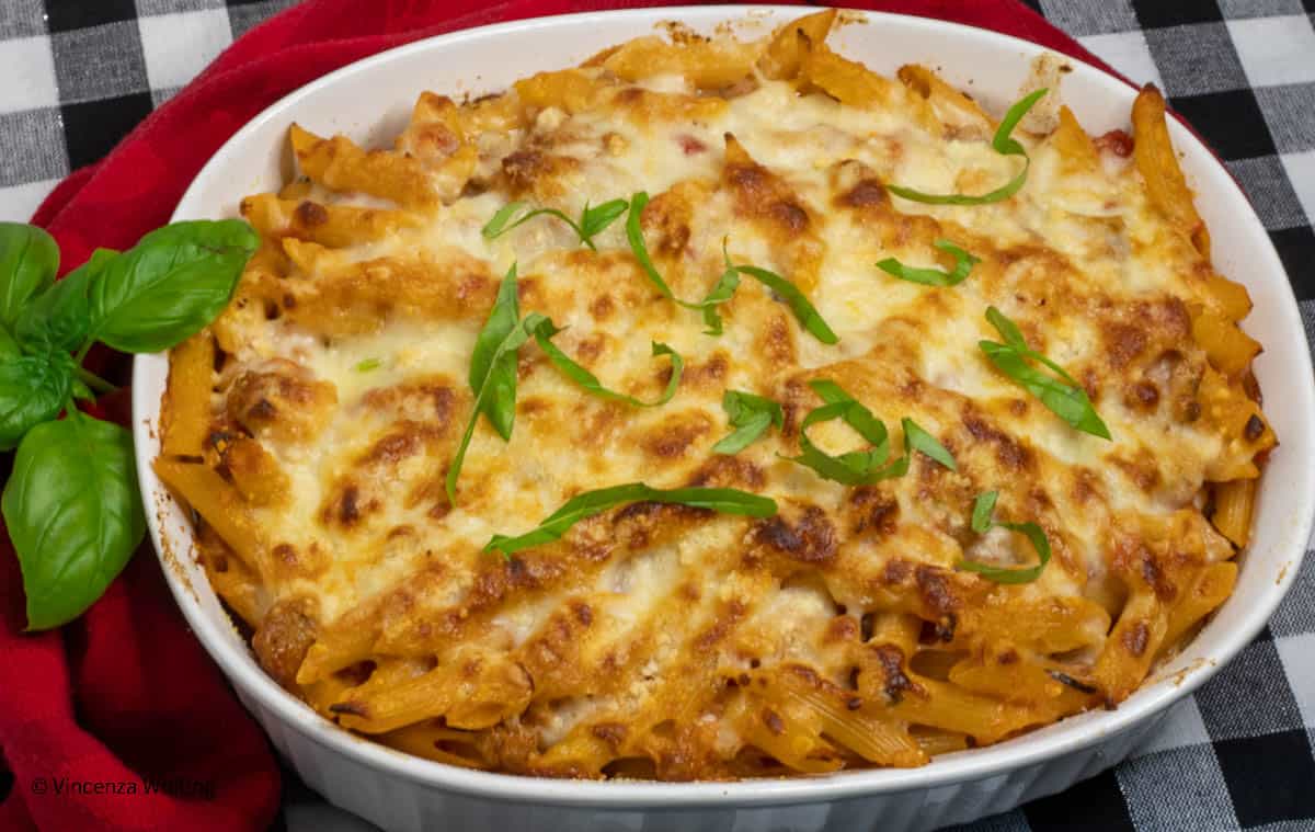 An oval casserole dish of baked pasta rustica.