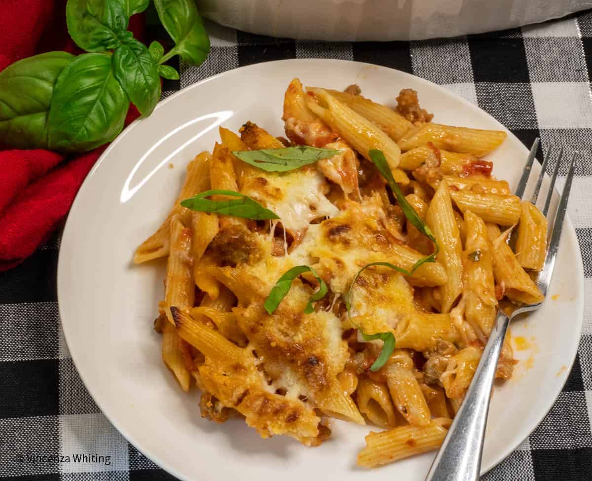 A dish of baked pasta with sauce and cheese.