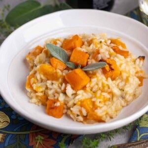 A white bowl of butternut squash risotto.