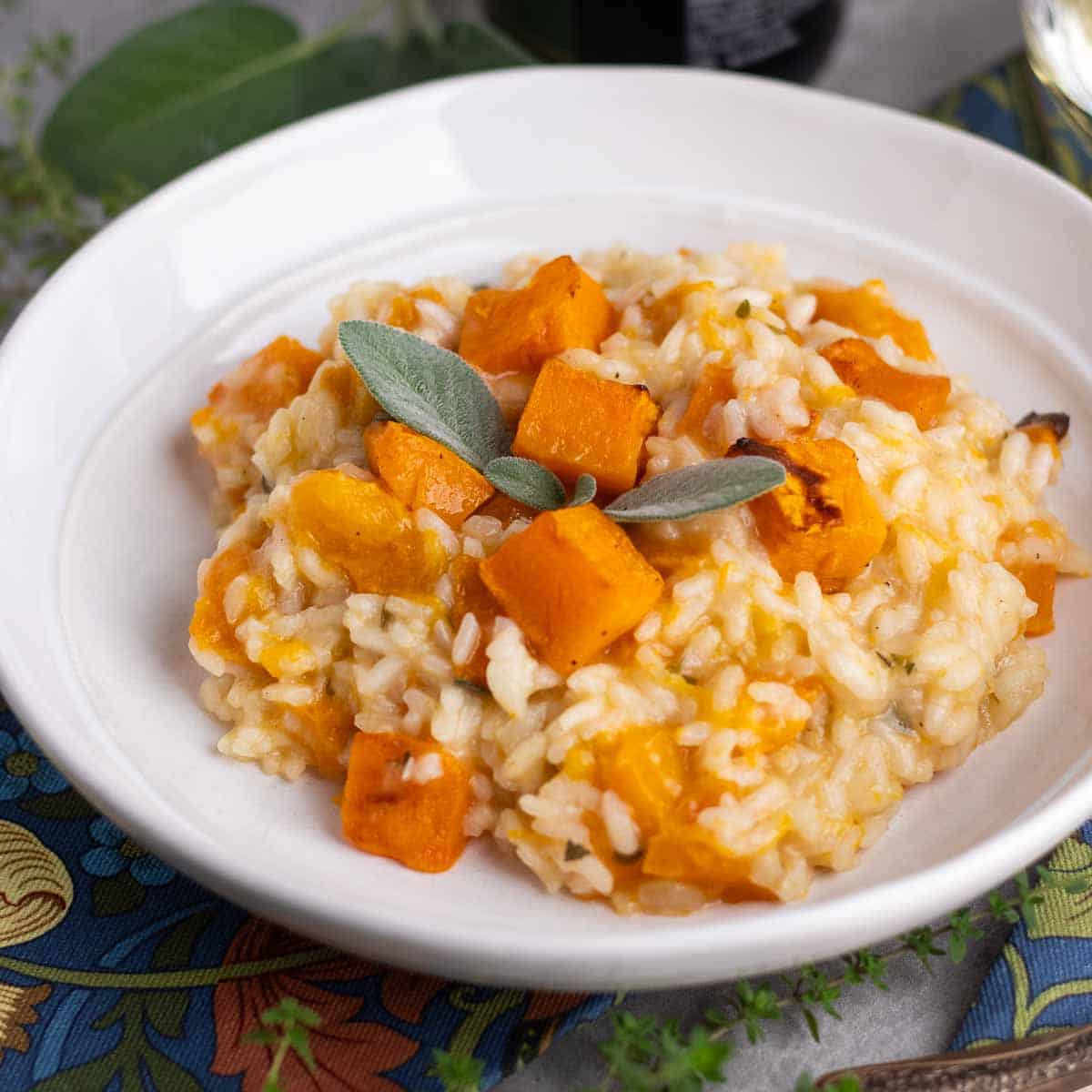A white bowl of butternut squash risotto.  