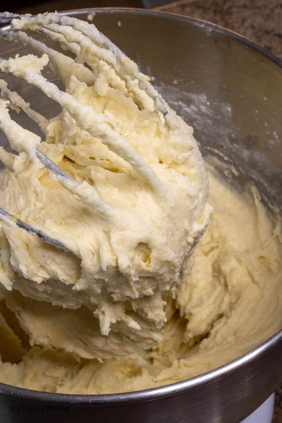 Lemon ricotta cookie dough on a beater.