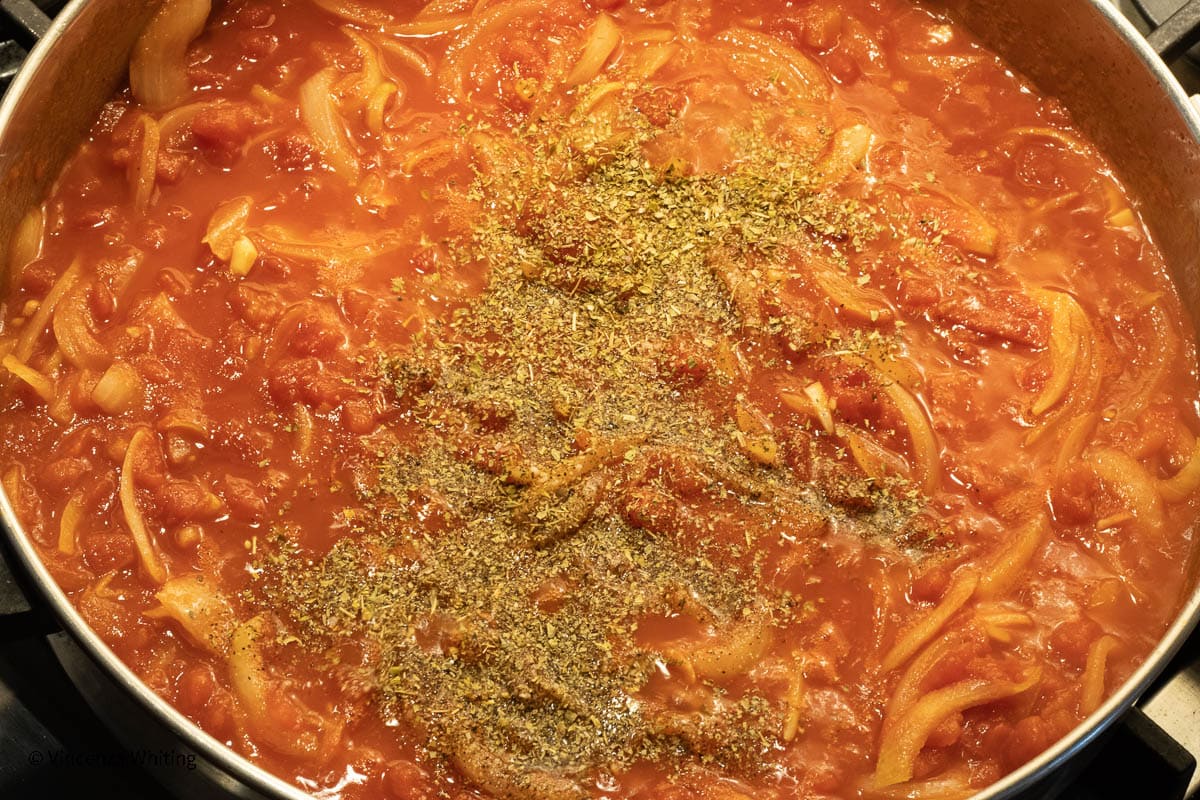 Tomato sauce with lots of onions sprinkled with seasonings.