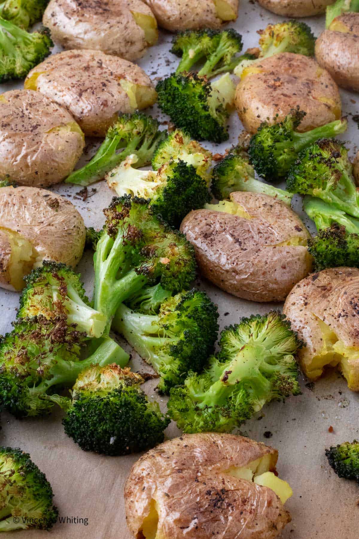 Roasted Potatoes and broccoli on a sheet pan.