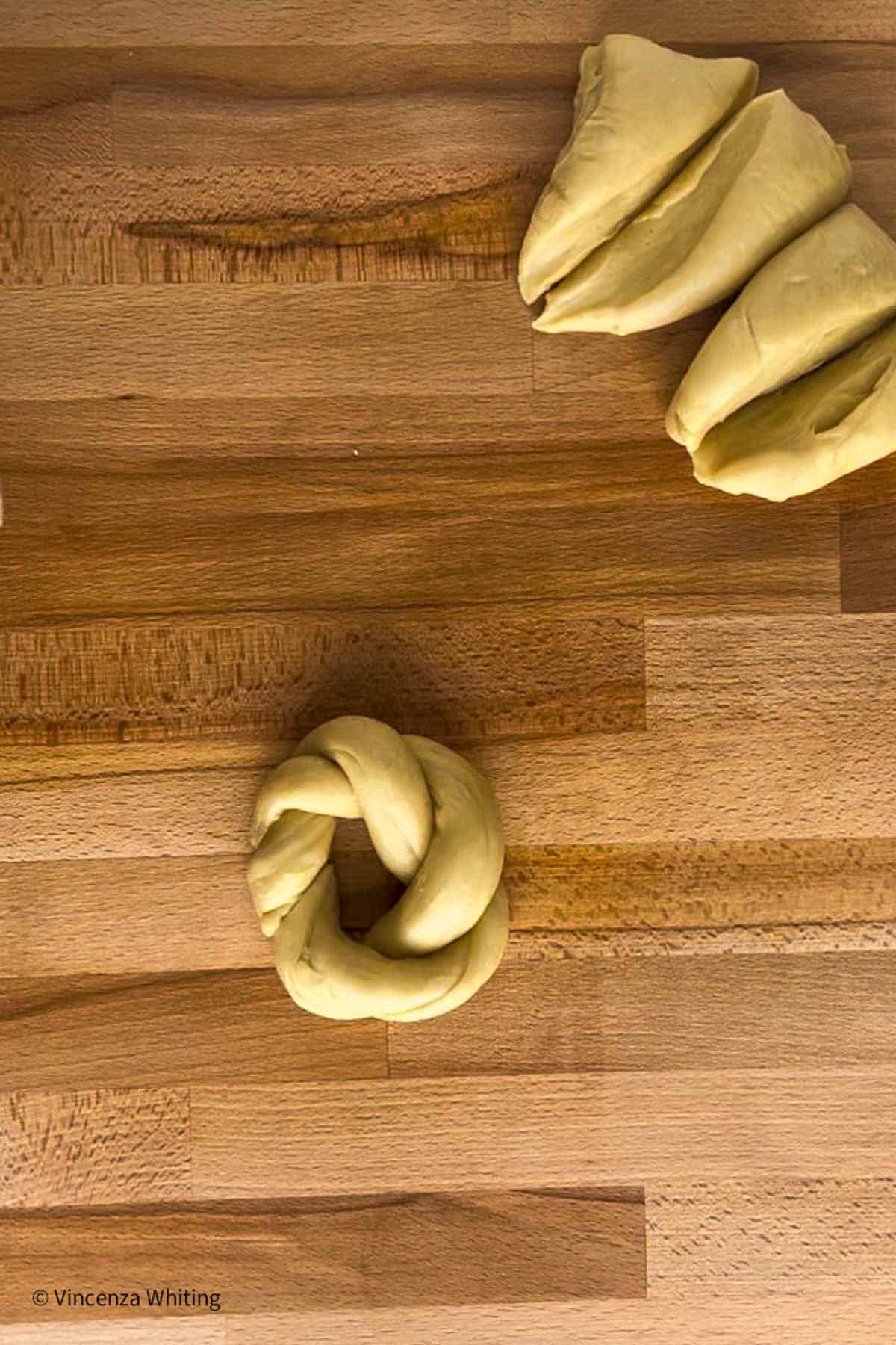Bread dough formed into a nest with a hole in the center.