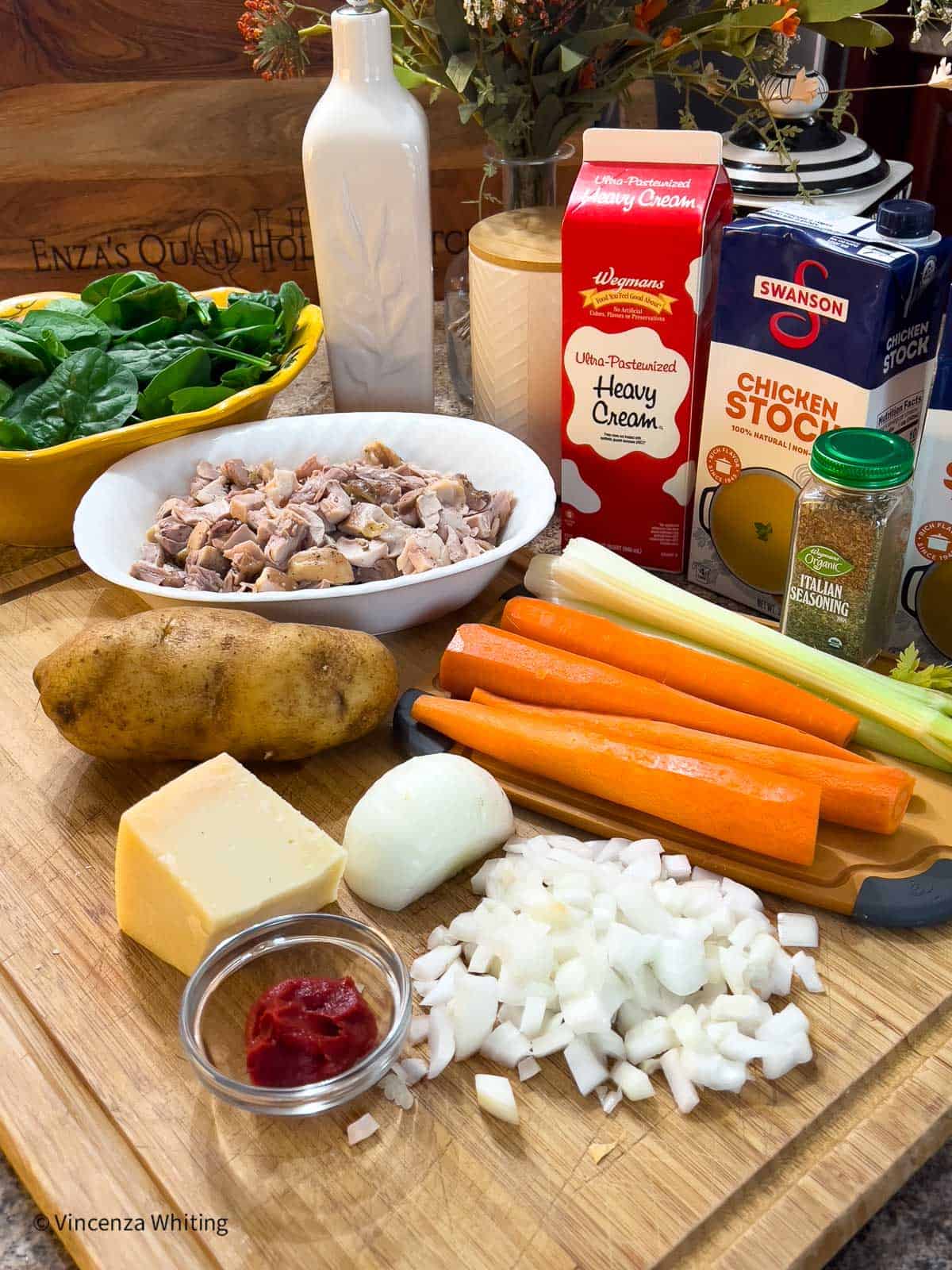 Ingredients for making Chicken soup on a wooden board.