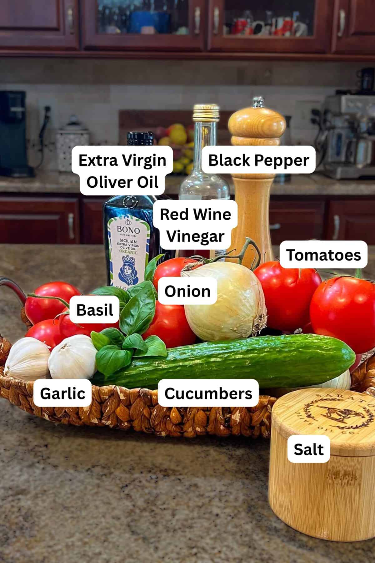 Ingredients for cucumber and tomato salad with labels on each ingredient.