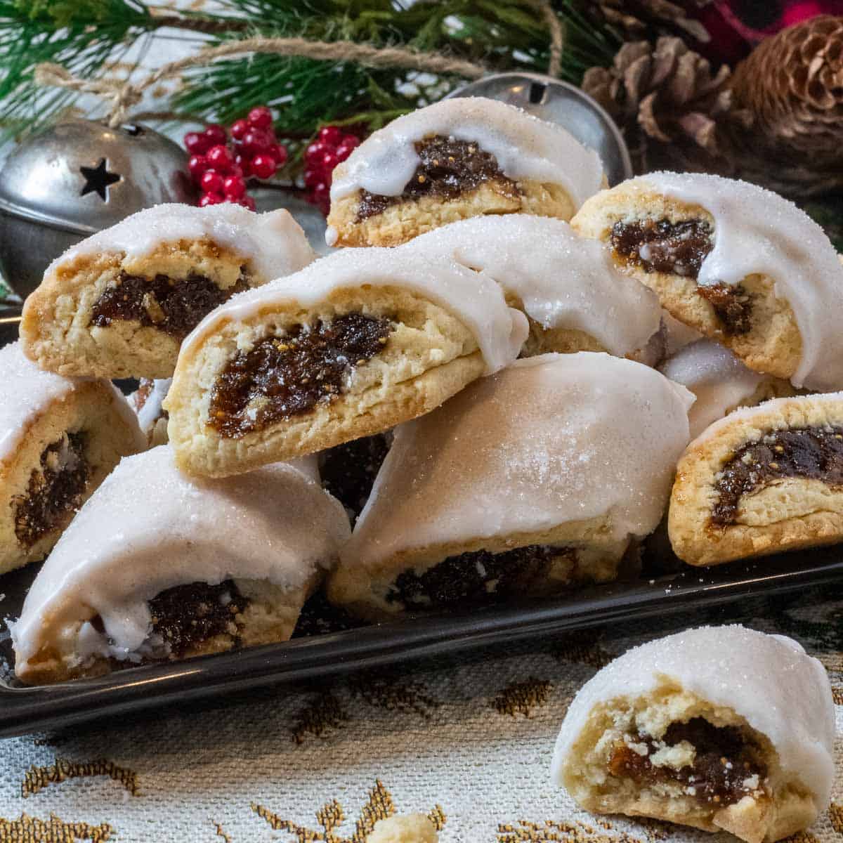 A plate of cuccidate in front of christmas decorations.