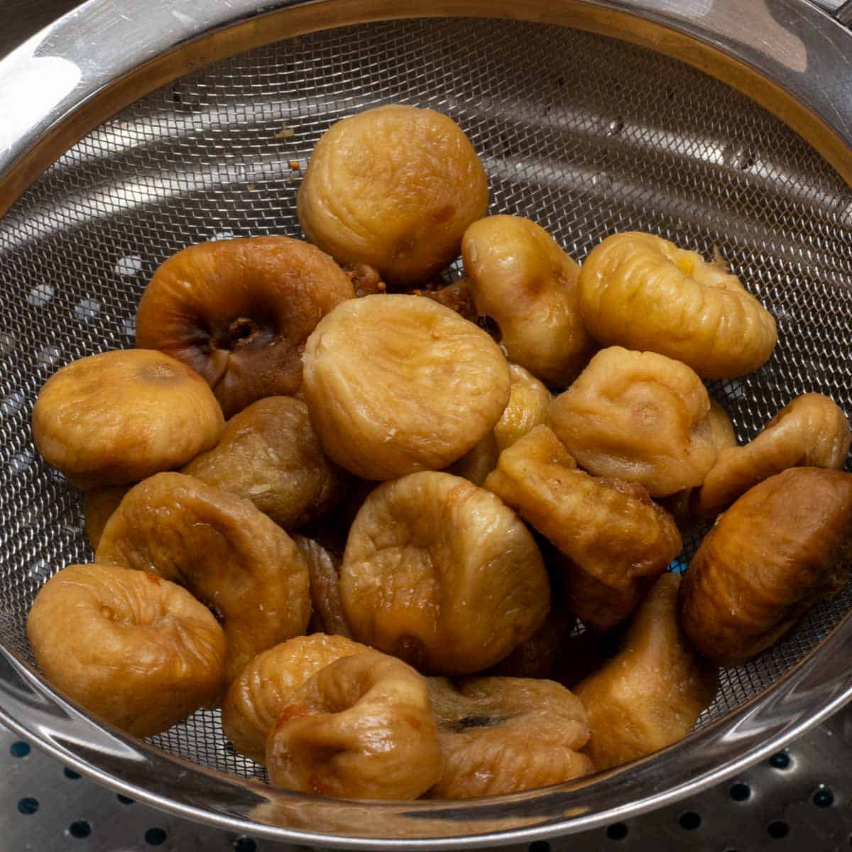 Rehydrated figs in a colander. 