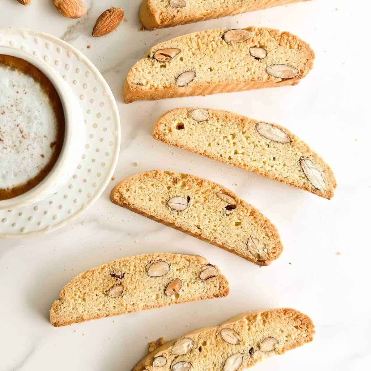 Cantucci, Italian almond biscotti next to a cup of coffee. 