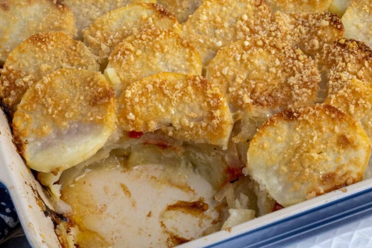 Sliced roasted potatoes with peppers and onions.