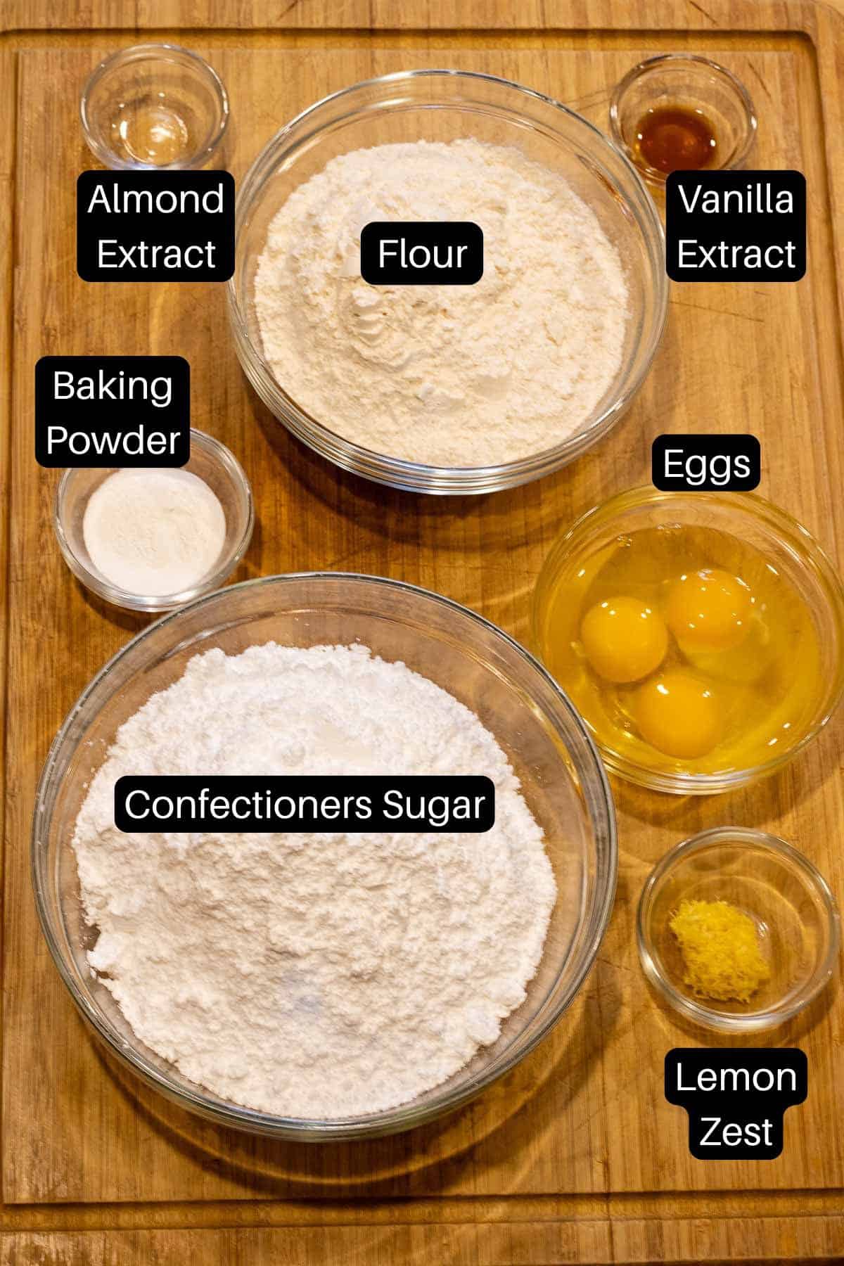 Ingredients to make Ossa di Morti cookies with labels over each item.  