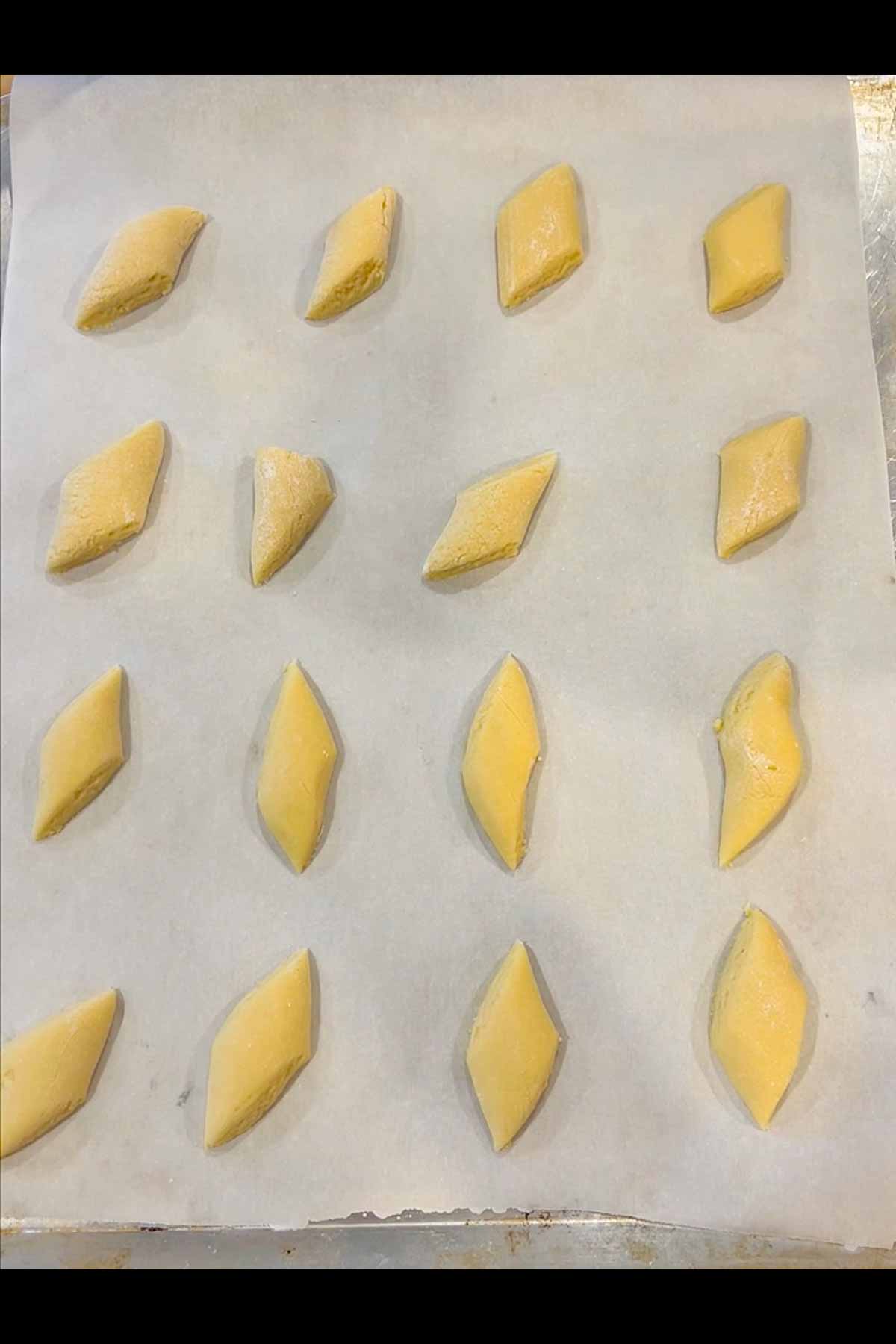 Cookineies on a parchment lined cookies sheet.  