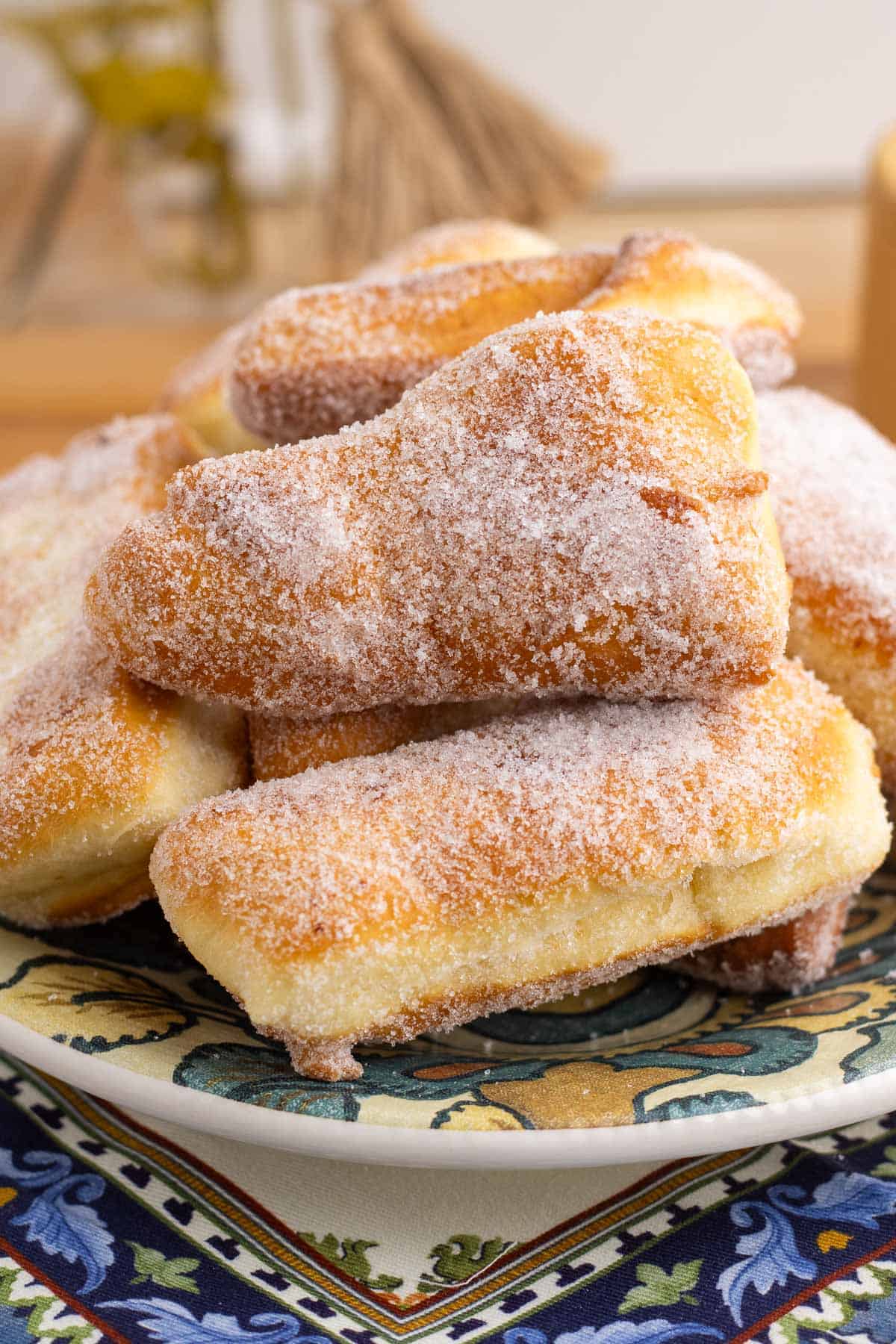 A plate of my nonna's fried dough tossed in sugar.