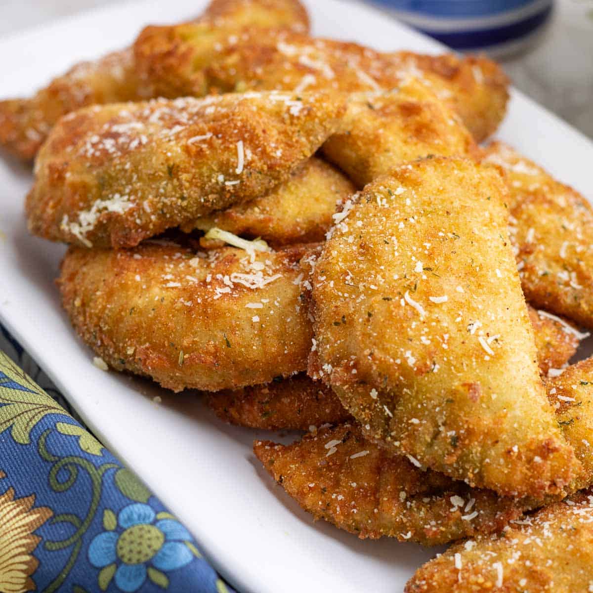 Sofficini, Italian savory fried pastry pockets on a white plate.