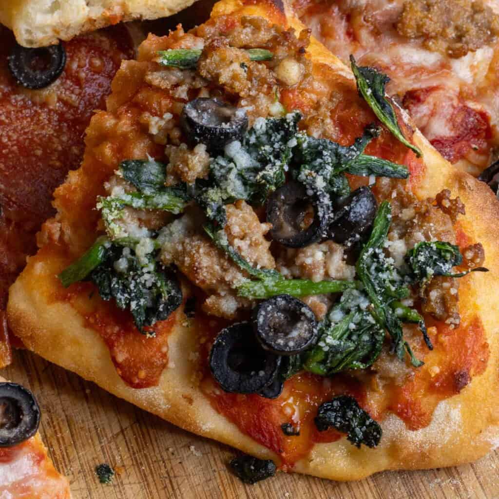 Spinach and sauasage topped Pinsa Romana