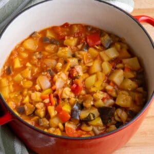 A Dutch oven filled with Ciambotta, Italian vegetable stew.